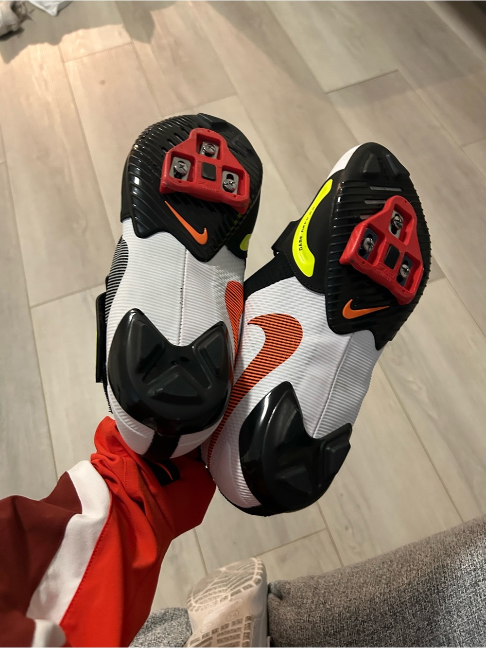 Nike White Cycling Shoes with Orange Swoosh and Red Cleats
